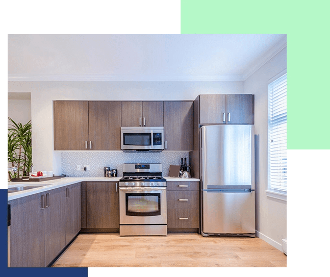 A kitchen with stainless steel appliances and wooden cabinets.